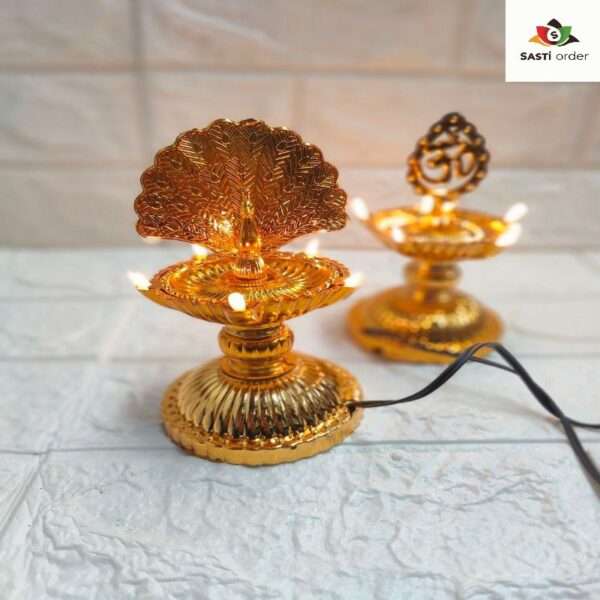 A beautifully designed Diya Light Peacock, featuring an intricate peacock shape adorned with colorful patterns. The diya emits a warm, soft glow, creating a serene ambiance. Made from durable materials, it is ideal for both indoor and outdoor use, perfect for enhancing decor during festivals like Diwali or special occasions. The elegant design adds a touch of artistry to any space.