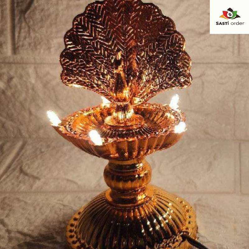 A beautifully designed Diya Light Peacock, featuring an intricate peacock shape adorned with colorful patterns. The diya emits a warm, soft glow, creating a serene ambiance. Made from durable materials, it is ideal for both indoor and outdoor use, perfect for enhancing decor during festivals like Diwali or special occasions. The elegant design adds a touch of artistry to any space.