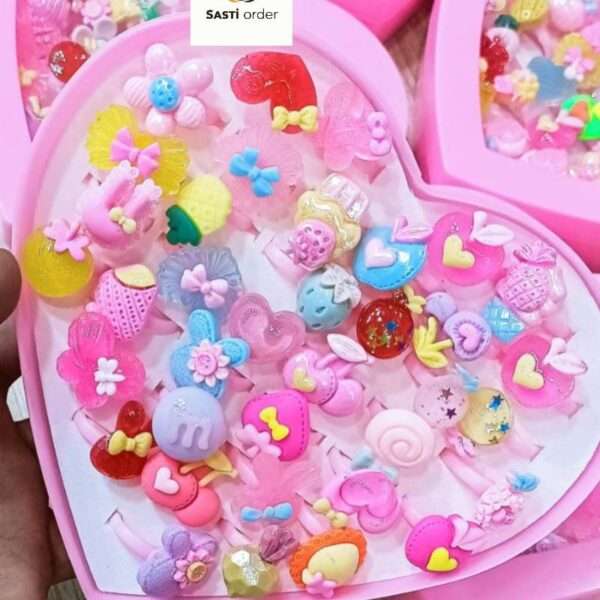A collection of colorful heart shape kids fancy rings, designed for children, showcasing vibrant hues and playful designs, perfect for dress-up and special occasions.