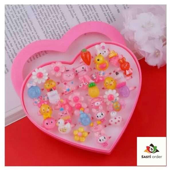 A collection of colorful heart shape kids fancy rings, designed for children, showcasing vibrant hues and playful designs, perfect for dress-up and special occasions.