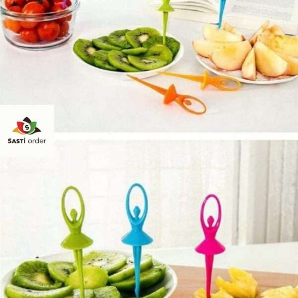 A set of Multicolour Fiber Dancing Doll Fruit Forks, showcasing vibrant colors and playful dancing doll designs, arranged on a colorful tablecloth with fruit and snacks in the background.