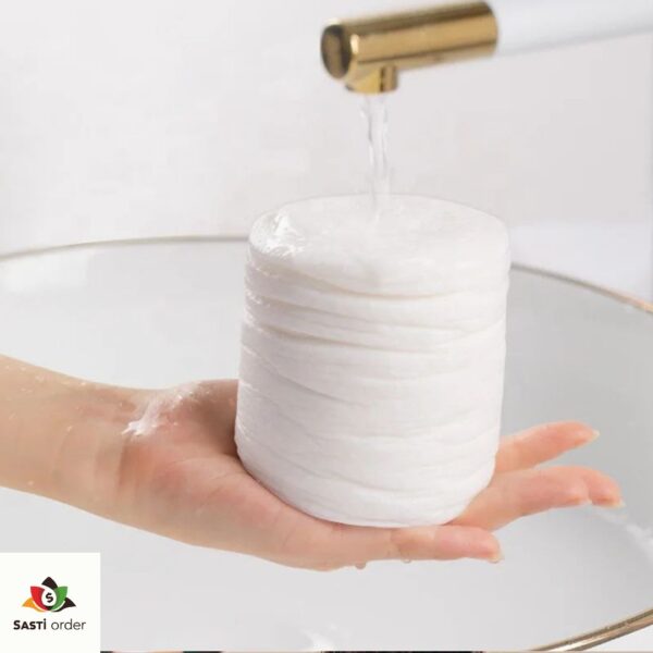 Compressed travel bath towel in a compact tablet form, ready to expand when wet, demonstrating its portability and convenience for on-the-go hygiene.