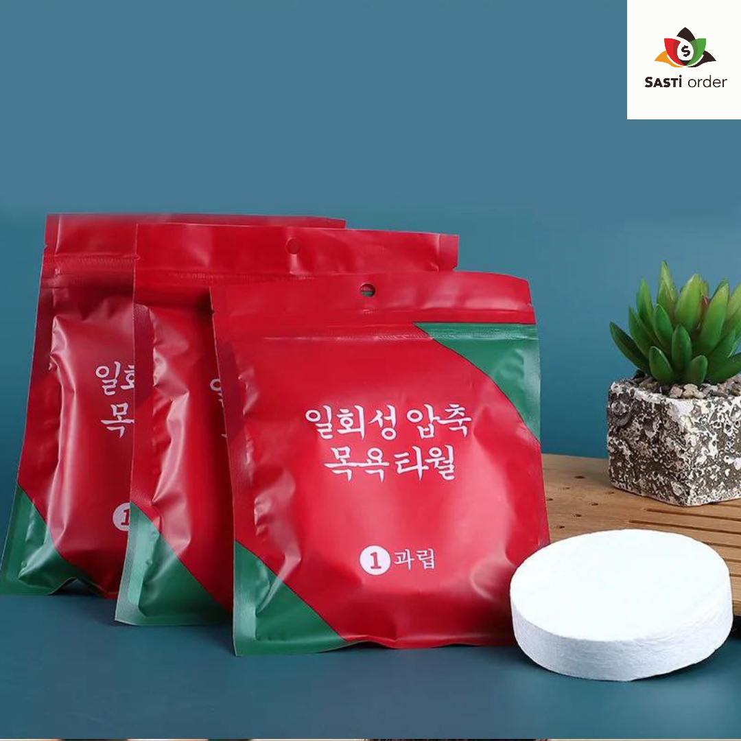 Compressed travel bath towel in a compact tablet form, ready to expand when wet, demonstrating its portability and convenience for on-the-go hygiene.