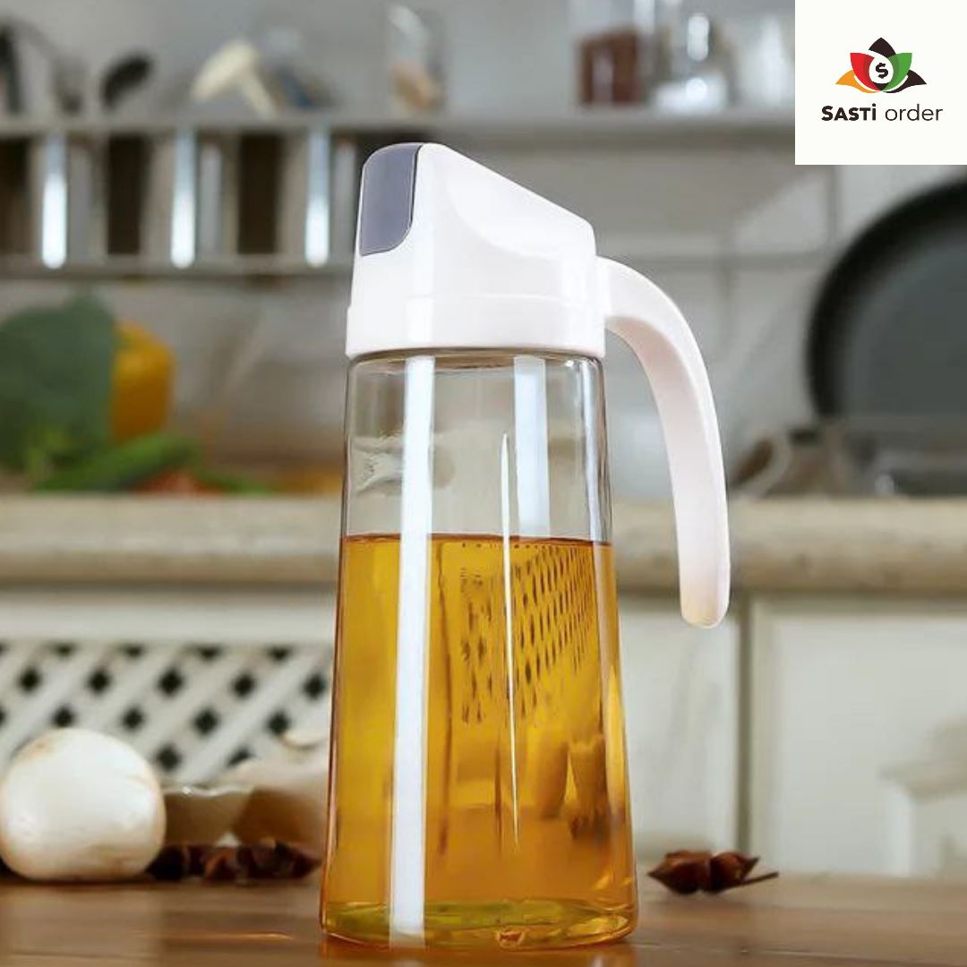 Auto Flip Cooking Oil Bottle, 500ML, with a transparent body and automatic flip top mechanism, displayed on a kitchen countertop.