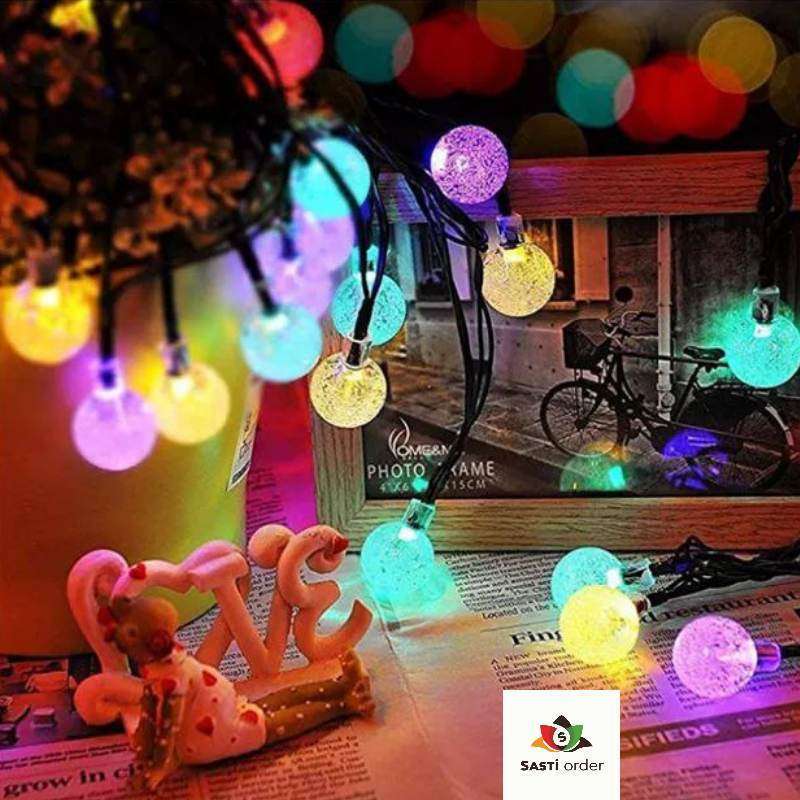 String of 10 multi-coloured ball lights, perfect for vibrant and decorative lighting indoors or outdoors, adding a fun and festive touch to any space.