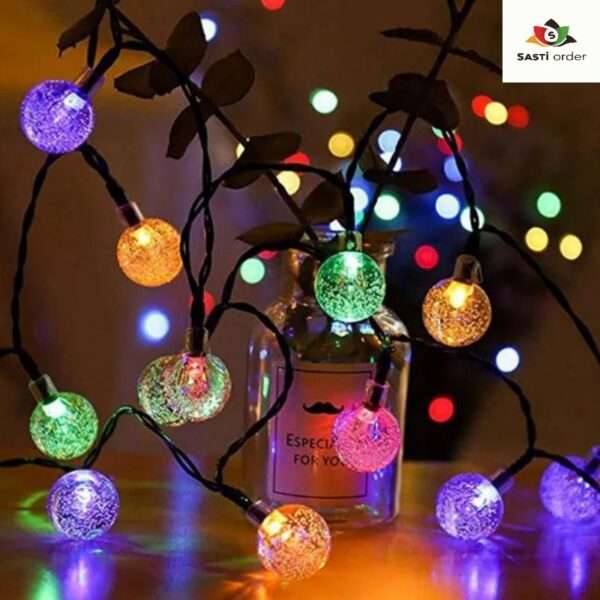 String of 10 multi-coloured ball lights, perfect for vibrant and decorative lighting indoors or outdoors, adding a fun and festive touch to any space.