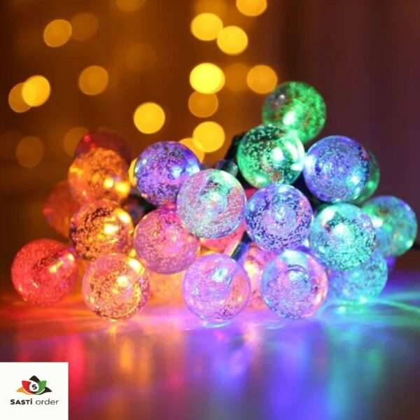 String of 10 multi-coloured ball lights, perfect for vibrant and decorative lighting indoors or outdoors, adding a fun and festive touch to any space."