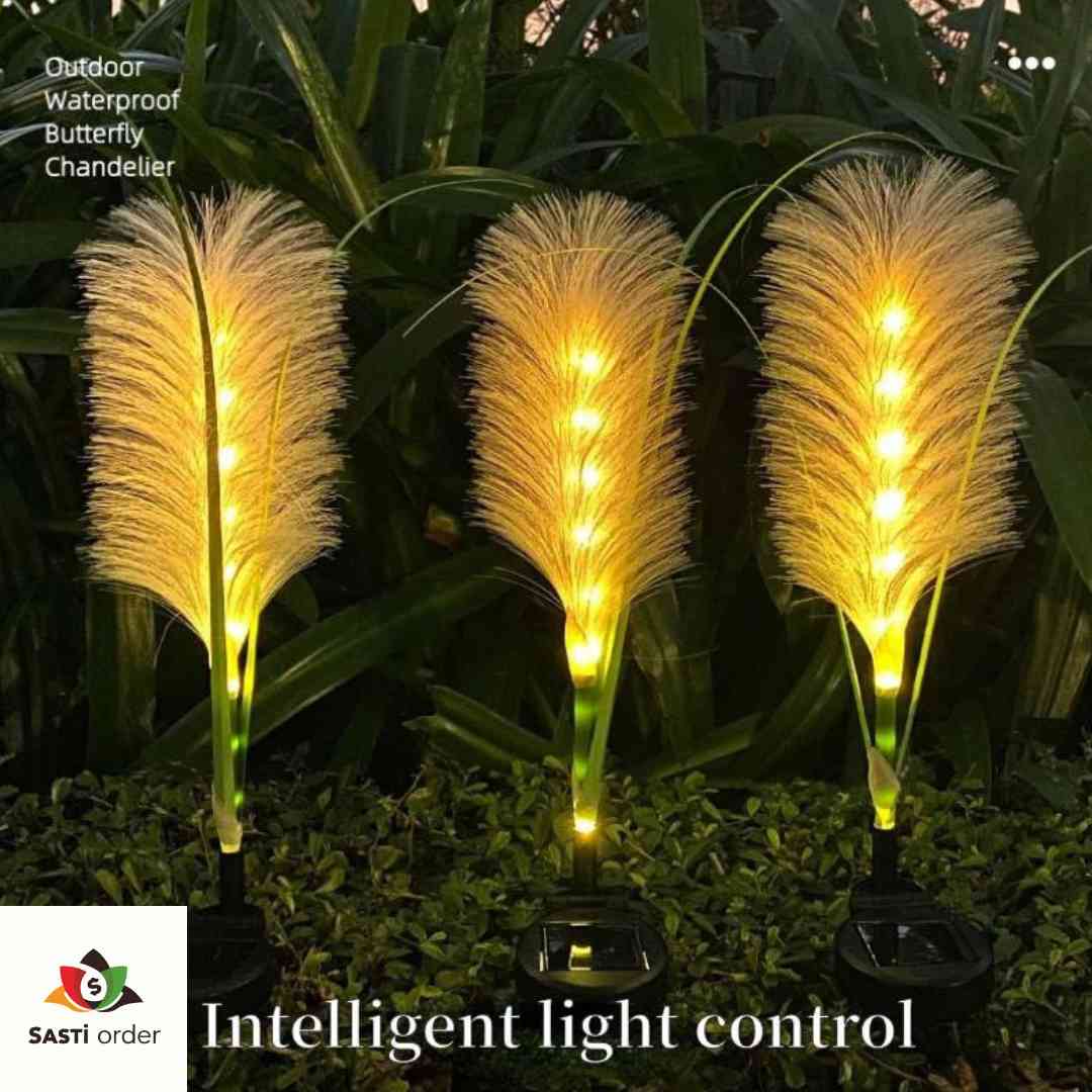 "Solar LED reed garden lamps illuminating a garden pathway, featuring eco-friendly, solar-powered lighting with a natural reed design and warm LED glow."