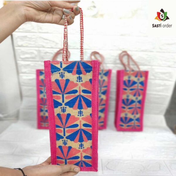 "Heavy Quality Embroidery Handheld Jute Bag featuring intricate designs, ideal for carrying water bottles and daily essentials."